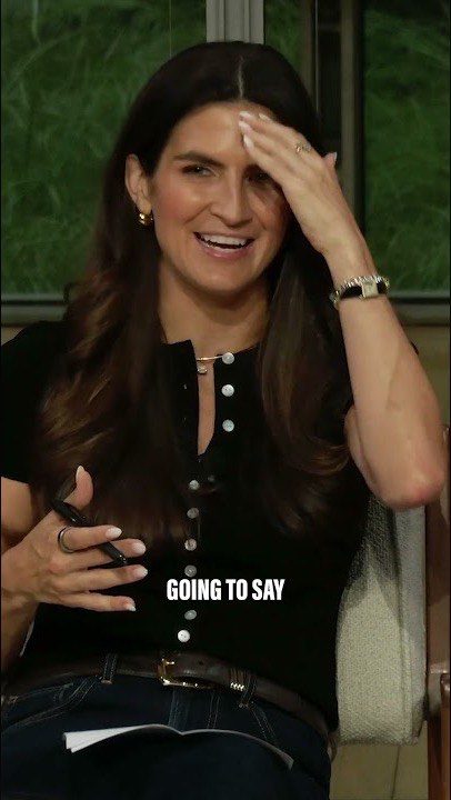 Vertical social clip: Kaitlan Collins laughing mid-interview